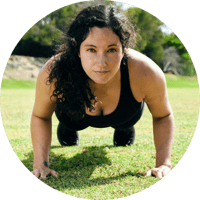 Woman with long dark hair doing a pushup
